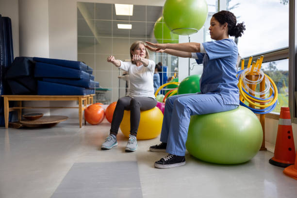 Physical Therapist showing patient exercises